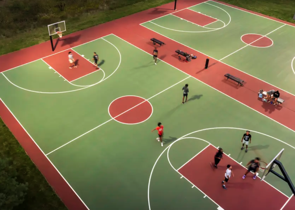 94' x 50' red and green backyard basketball court in Houston with optional mini basketball court use